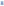 Front view of blue cotton and tulle dress showing layered skirt construction and short sleeves on white background