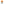 Two ribbed knit beanies on white background - bright orange beanie with dark grey rectangular patch on top, light grey beanie with dark patch below