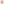 Young blonde girl wearing bright pink cable knit hat with fluffy pom pom, smiling at camera against white background