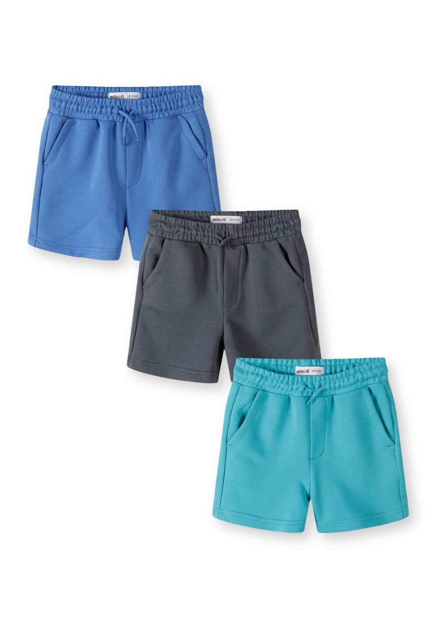 Three pairs of boys shorts in blue, grey and turquoise arranged vertically on white background