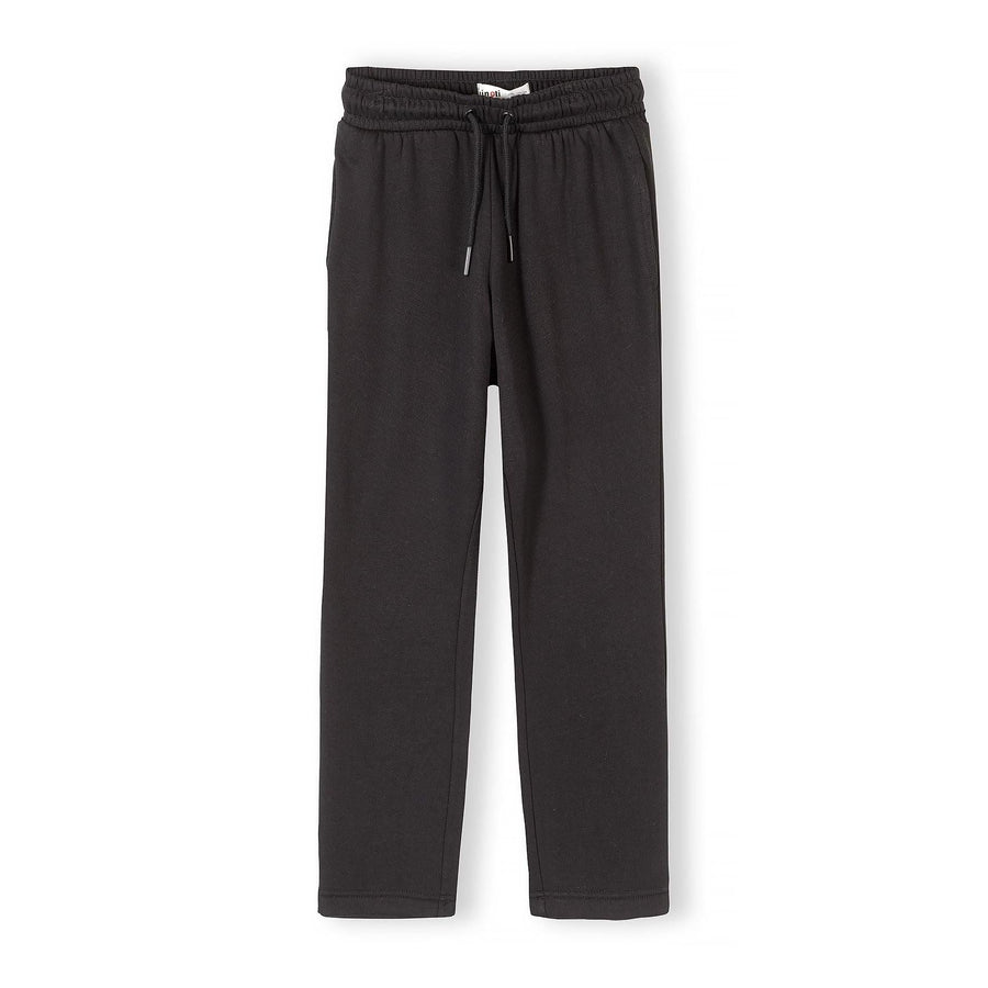 Black wide leg joggers with elastic waistband and drawstring on white background, front view showing full length relaxed fit
