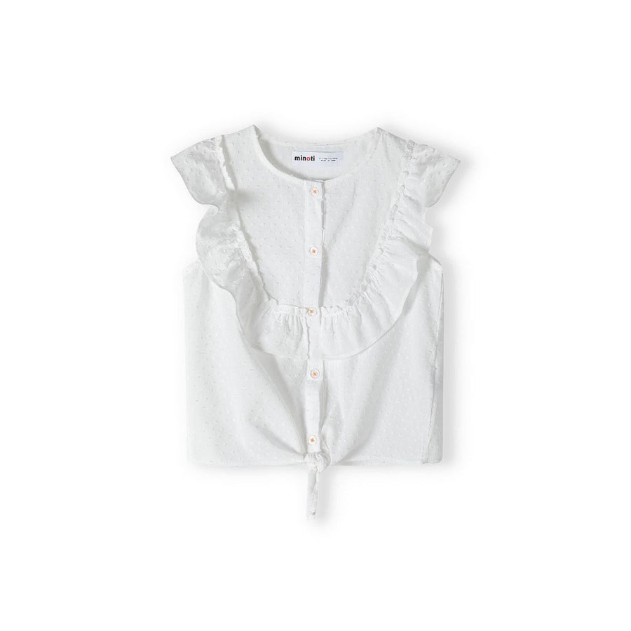 White broderie anglaise sleeveless top laid flat showing back view with ruffle cap sleeves and tie detail at bottom hem